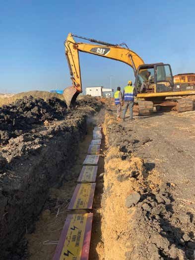 Excavator preparing a straight pipeline trench