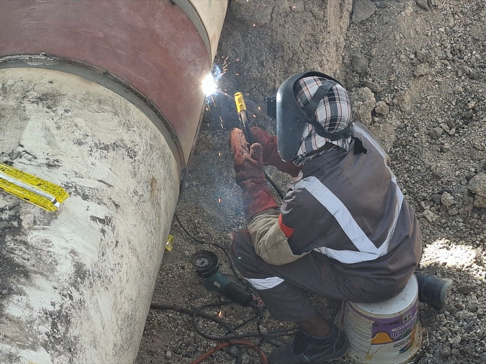 Welder completing a repair sleeve weld